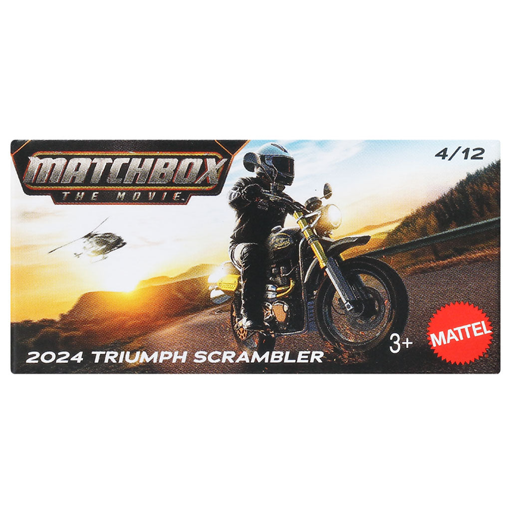 A Matchbox The Movie 2024 Triumph Scrambler 4/12 card from a Mattel toy collection, featuring artwork of a motorcyclist on a scenic road at sunset.
